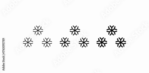 several falling snowflakes icon sign vector