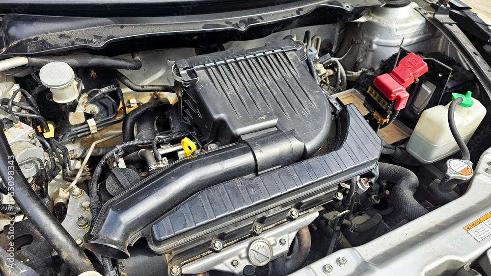 Fototapeta premium Engine's Intricacies Unveiled: A close-up view of a car engine's core components, showcasing its technical design and mechanical prowess.