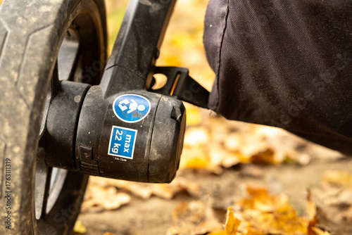 Symbol on a buggy indicating the maximum weight of a child than can be transported - Concept of issues families with disabled children are having