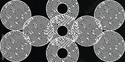 Abstract artwork featuring multiple circular patterns with intricate black and white designs on a dark background.