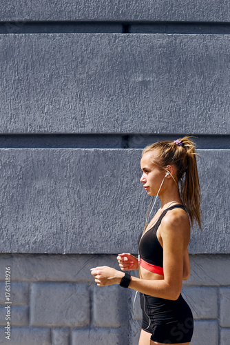 Young fit woman jogging outdoors