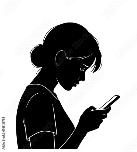 Silhouette of a young woman with her hair in a bun looking down at her smartphone screen