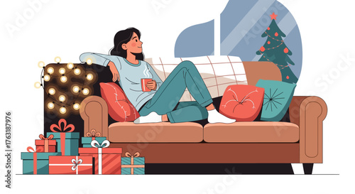 Woman relaxing on couch with Christmas gifts and tree.
