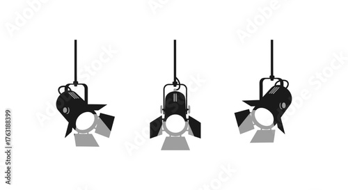 Three spotlights hanging from the ceiling isolated on white background casting light