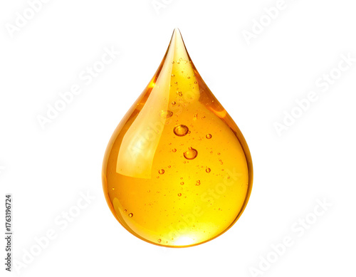 A solitary droplet of golden, translucent liquid against a stark, black background