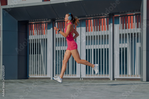 Outdoor running session in vibrant athletic wear on a sunny day