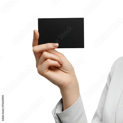 A person's hand elegantly holds up a blank black business card on a black background