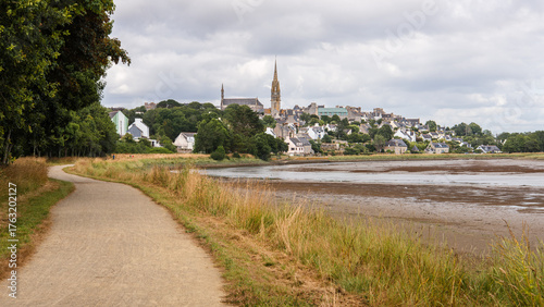View of the village of Pont-Croix and the Goyen River at low tide, under a cloudy sky, in the Finistere department of Brittany, France