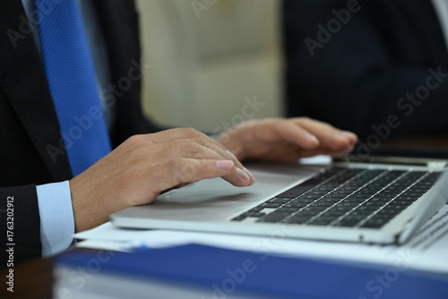 close up of a businessman working on laptop