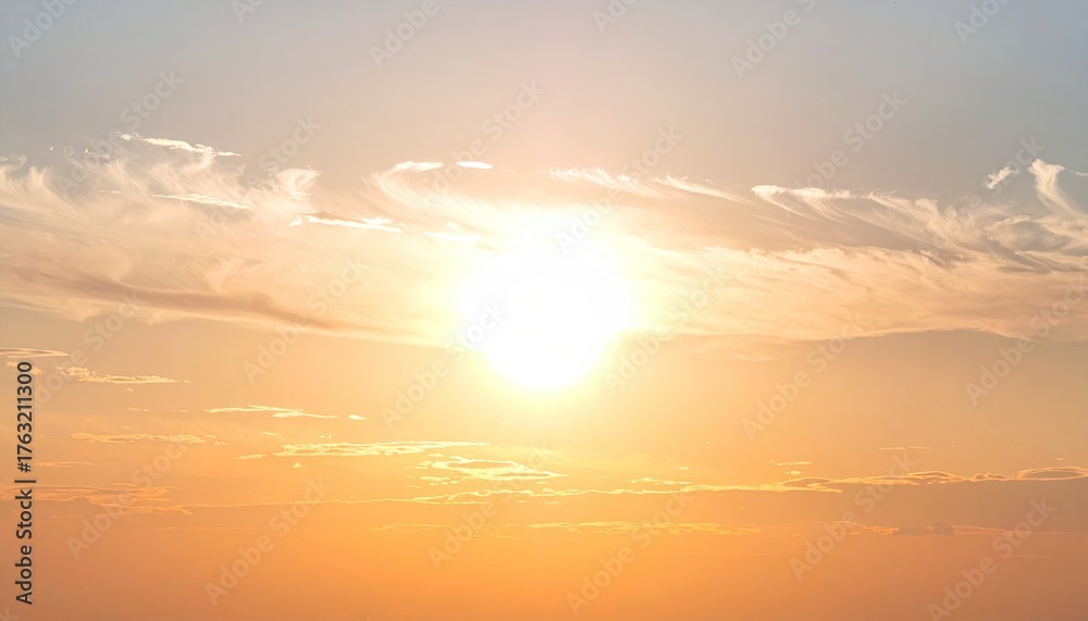 Obraz premium Glowing orb surrounded by wispy clouds in an open sky. Soft, warm hues illuminate the scene