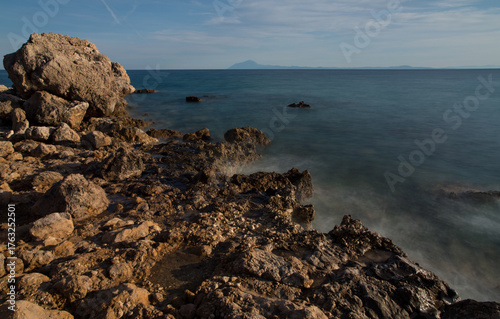 Принти на полотні Long exposure of waves hitting the rocks during sunset, Mediterranean, Greece