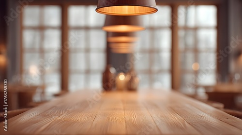 Community dining hall blurred long wooden table with warm hanging lamps