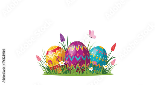Three vibrantly decorated Easter eggs nestled in spring grass.