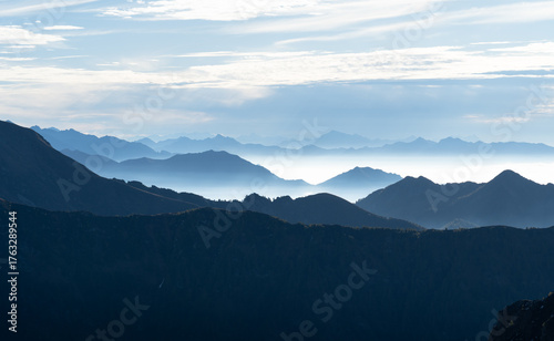 Layered Ticino mountains, on a hazy, autumn day.
