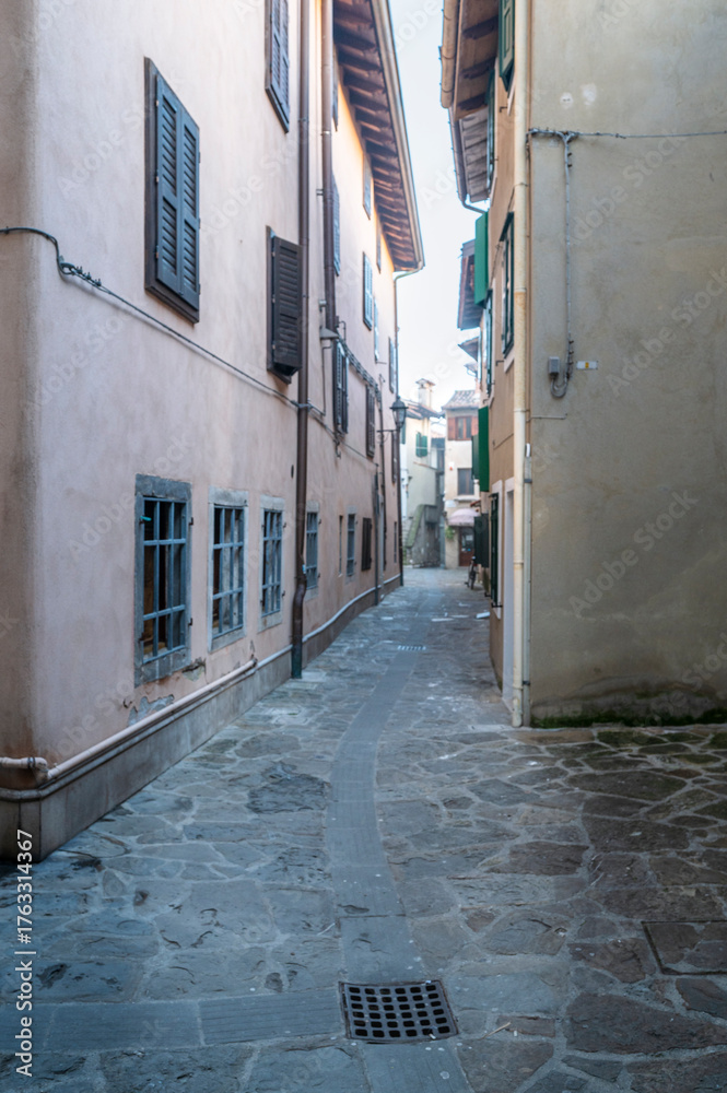 Fototapeta premium Between ancient history, art, and nature. The island of Grado in winter. The village and the sea. Friuli