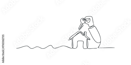 Hand holding key over simple house sketch