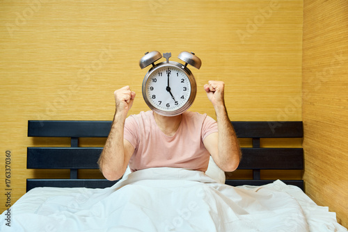 Shocked man with alarm clock instead of head has overslept. Lateness concept