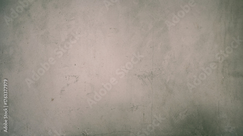 Grunge concrete wall texture with subtle cracks and stains for background use