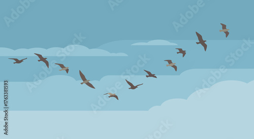 Flock of migratory birds flying in V formation in the sky.