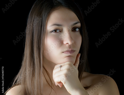 Thoughtful woman contemplating life decisions.