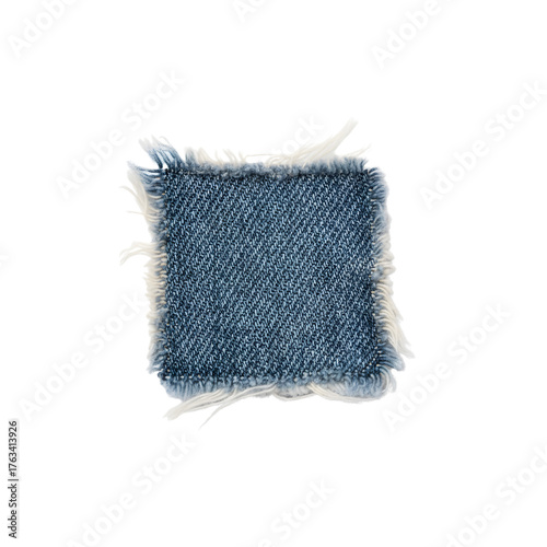 Fotografie Frayed blue denim fabric patch swatch