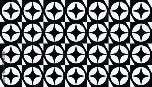 A seamless black and white geometric pattern featuring circular shapes with curved leaf-like forms arranged in a rhythmic grid. The contrast creates a bold and modern visual effect