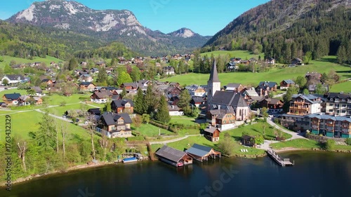 Experience breathtaking aerial views of Altausseer Lake in Austria Salzkammergut showcasing its clear waters, lush landscapes, and majestic mountains. Nature beauty in one spectacular shot.