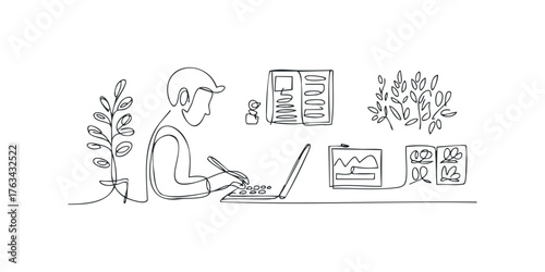 Person working on laptop with plants and desk items