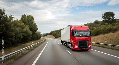 Wallpaper Mural A bright red commercial truck carries a white trailer down a scenic highway surrounded by lush greenery under a cloudy sky, representing the logistics and transportation industry. Torontodigital.ca