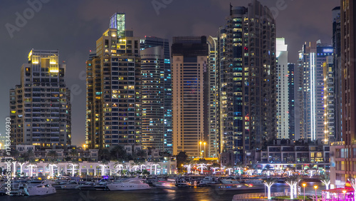 Dubai Marina towers and canal in Dubai day to night timelapse