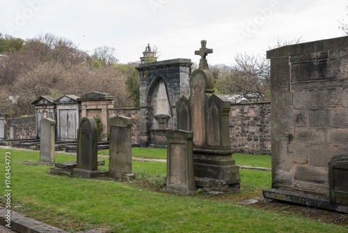 Graves in Canongate Kirkyard, Edinburgh. A historical burial site featuring notable tombstones and architecture.
