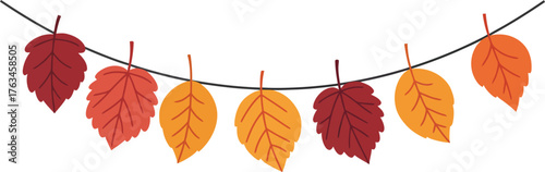 A string of colorful autumn leaves hanging on a wire against a white background.