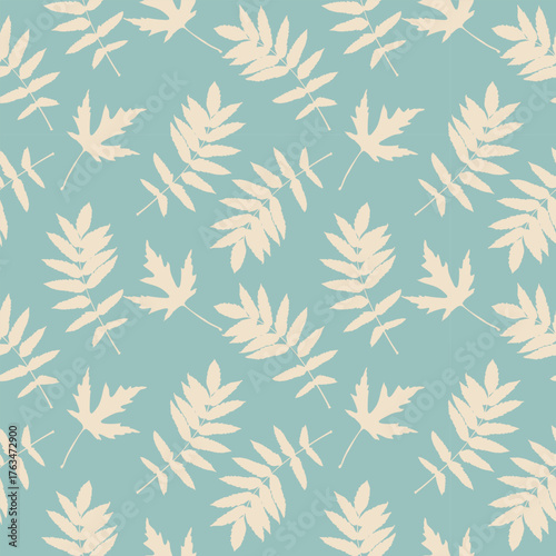Textile pattern pastel rowan leaves , creme leaves on blue pastel background. 