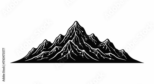 Majestic mountain range with sharp peaks and dramatic shadows, evoking adventure and natural beauty.