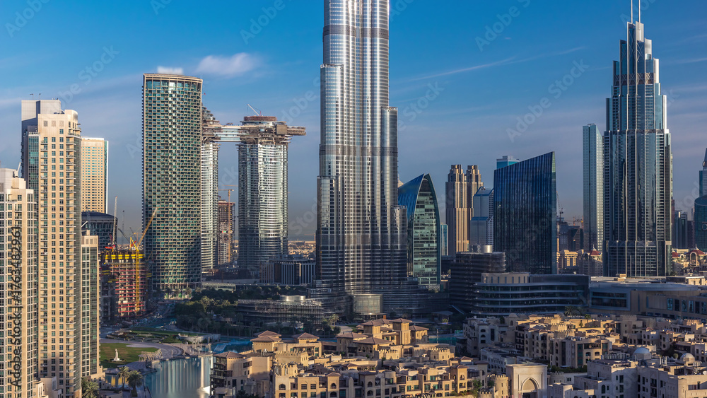 Naklejka premium Dubai Downtown skyline during sunrise timelapse with Burj Khalifa and other towers panoramic view from the top in Dubai