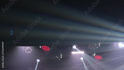 Intense spotlights create a dramatic, high-energy background. Concept for a main event, performance, or big announcement.