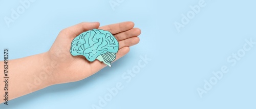 Hand holding paper human br...