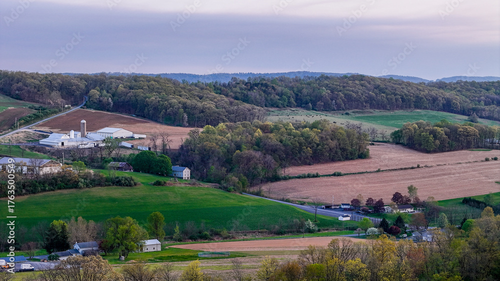 Naklejka premium Aerial landscape of corn fields farmland mountains sunset rural Appalachia Central Pennsylvania