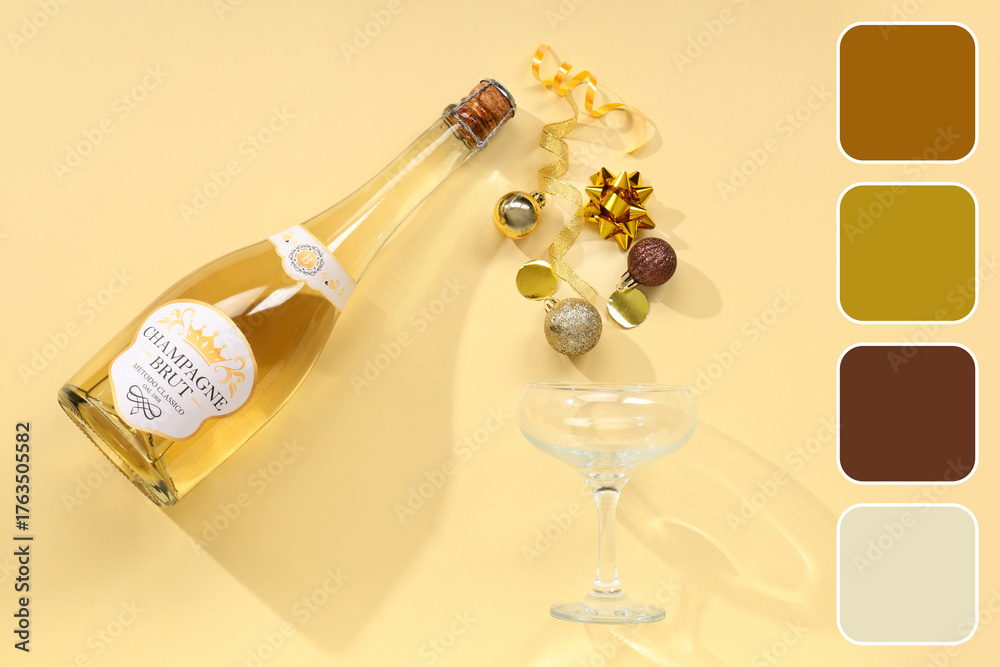 Fototapeta premium Bottle of champagne with glass and Christmas balls on yellow background