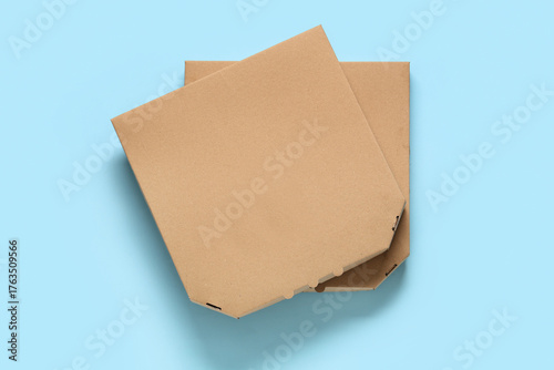 Two stacked cardboard pizza...