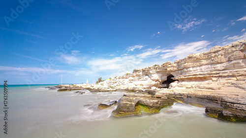 Bild auf Leinwand Seascape from the deserted shore to the caspian sea with blue sky and roaring wa