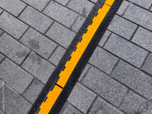 Cable passage channels are used to prevent damage to cables located in areas with heavy pedestrian and vehicle traffic.