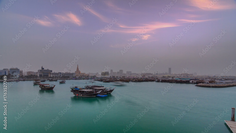 Fototapeta premium Sunset at Doha Bay timelapse with Traditional Wooden Dhow Fishing Boats.