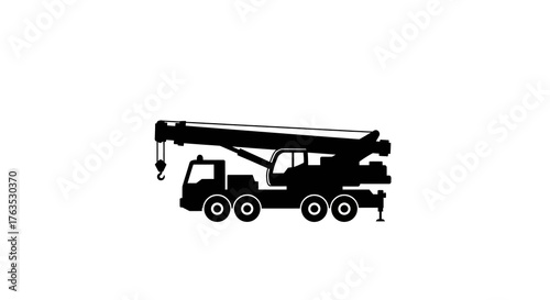 Silhouette of heavy duty mobile crane on white background