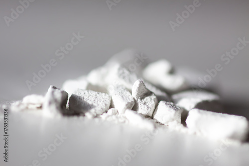 Closeup of loose powder with fine particles. Softness and tactile appeal in focus.