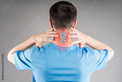 Osteochondrosis, neck pain, cervical spine hernia, man suffering from ache on gray background