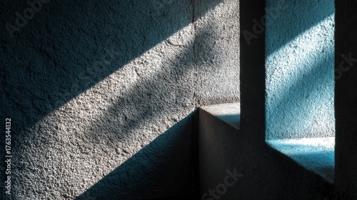 Light Play on Textured Concrete Wall Creating a Striking Contrast and Geometric Pattern in an Architectural Space