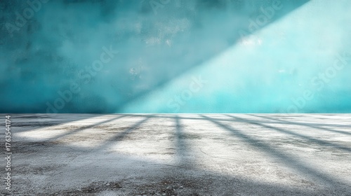 Minimalist Turquoise Wall with Sunlight Shadows Creates an Abstract Backdrop for Product Presentation