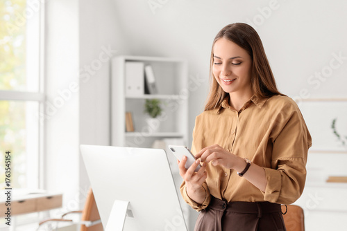 Young businesswoman using m...