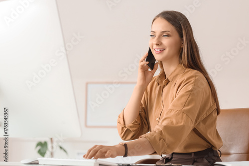 Young businesswoman talking...